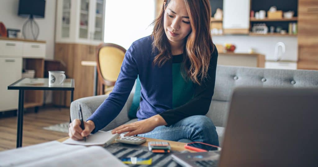 Woman paying bills on computer