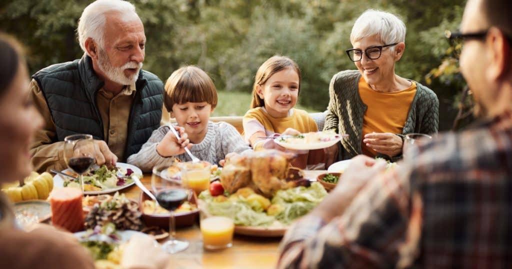 Multigenerational family eating dinner