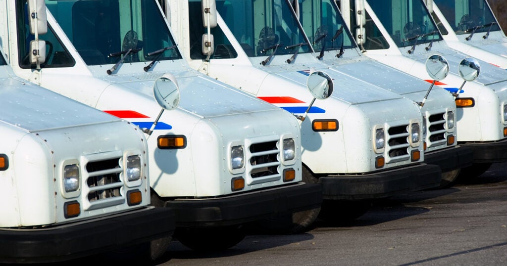 Group of U.S. Postal Office trucks