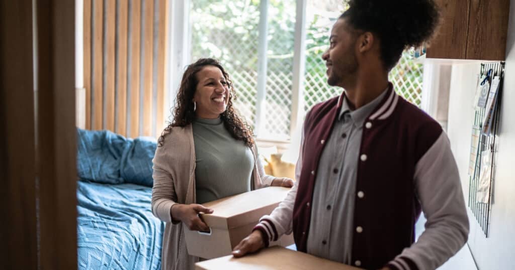 Mother helps her son move into dorm room